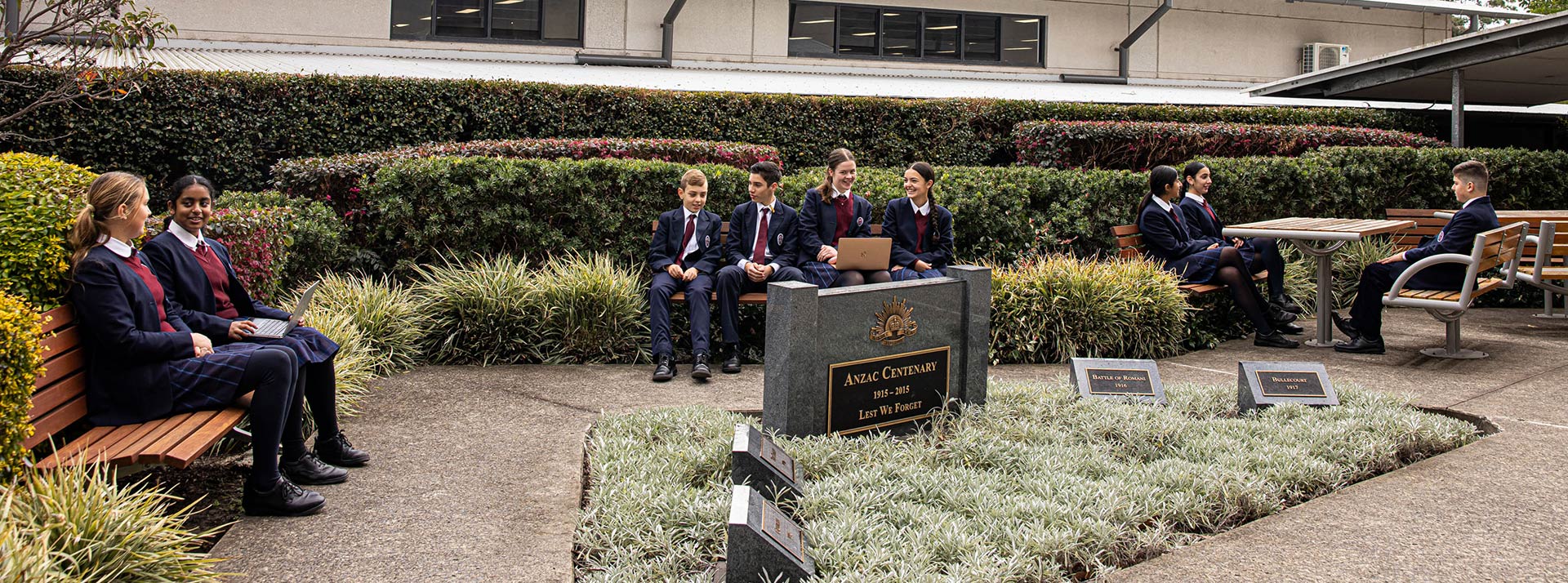 Marian Catholic College students sitting outside by the Anzac Centenary